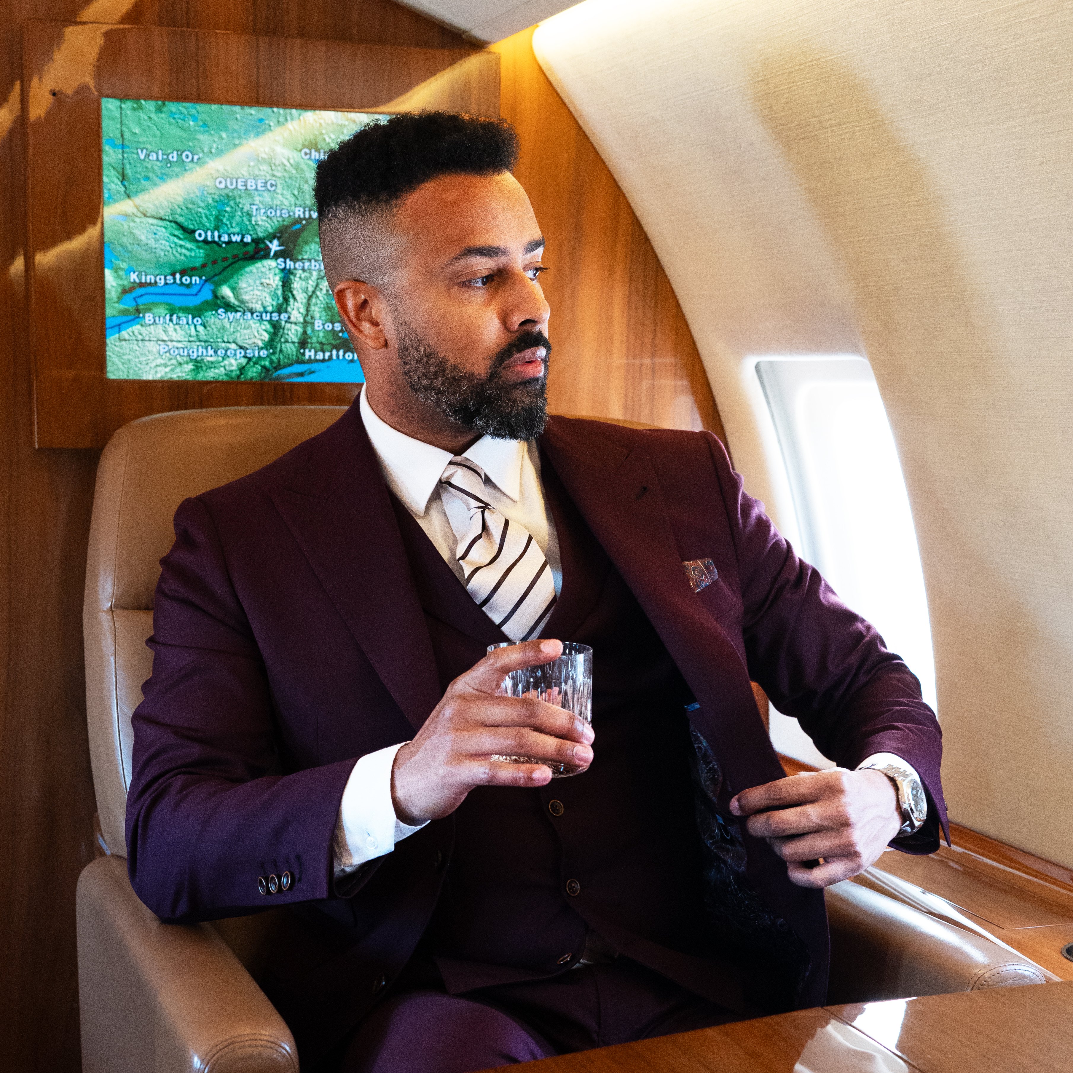 men-in-burgundy-suit-with-stripe-white-tie-sit-in-plane.jpg men-in-burgundy-suit-with-stripe-white-tie-sit-in-plane.jpg